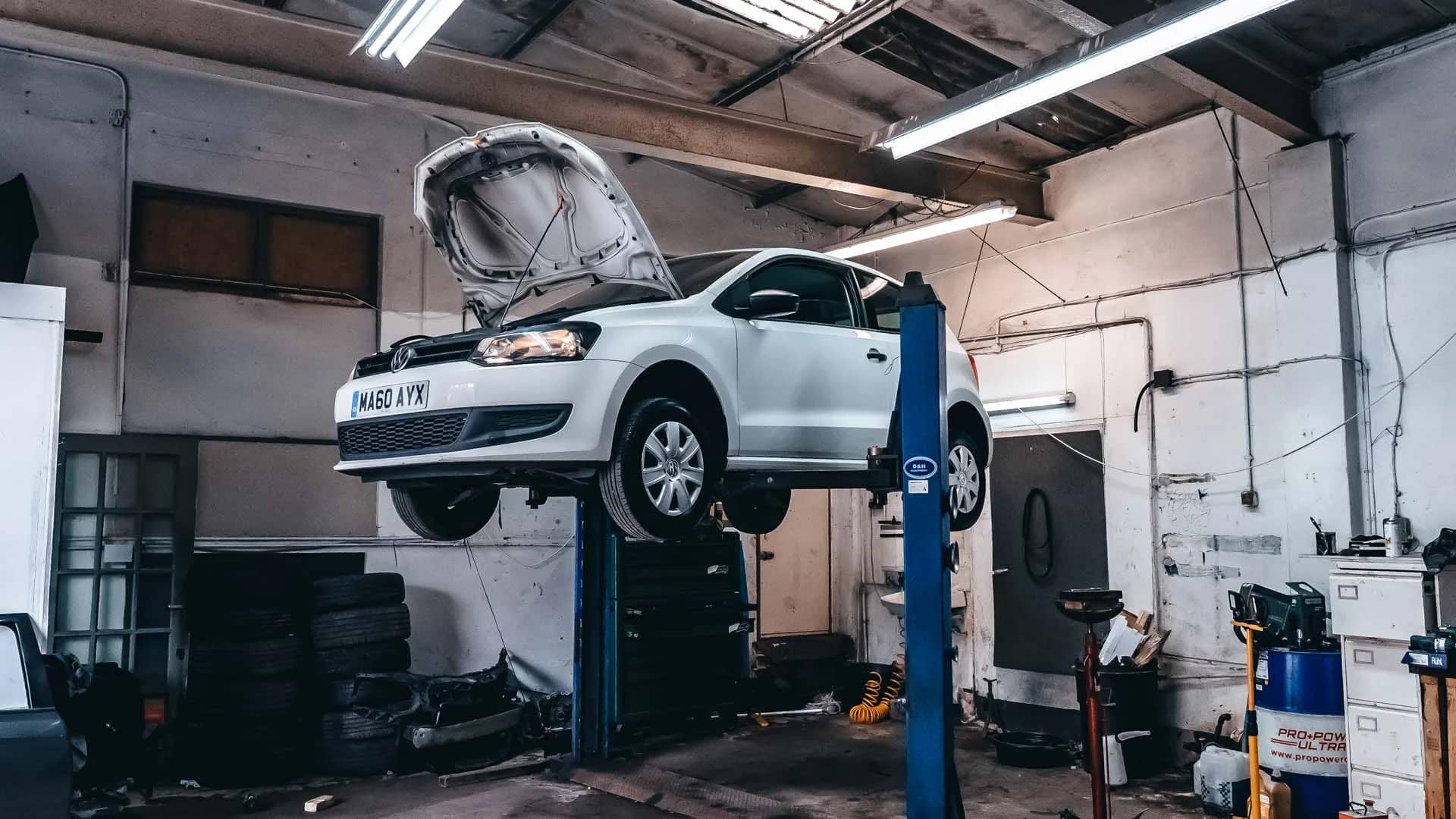 Car elevated on the MOT bay at MotorWorld, side angle
