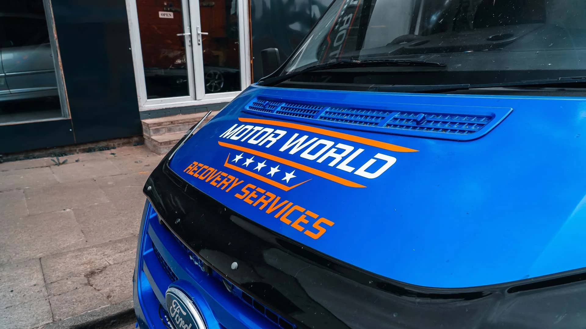 Van with its bonnet up ready for an interim service check at MotorWorld