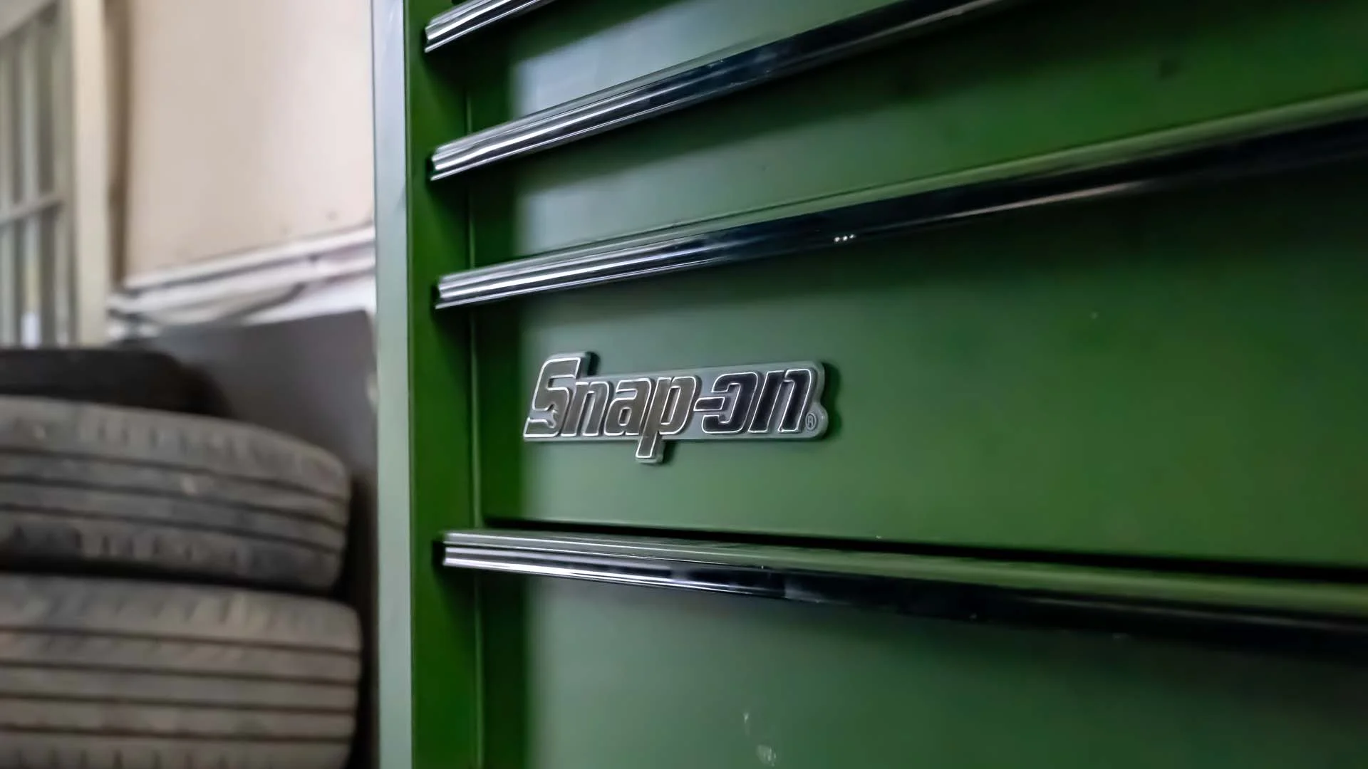 Close-up of a green Snap-on toolbox inside the MotorWorld workshop